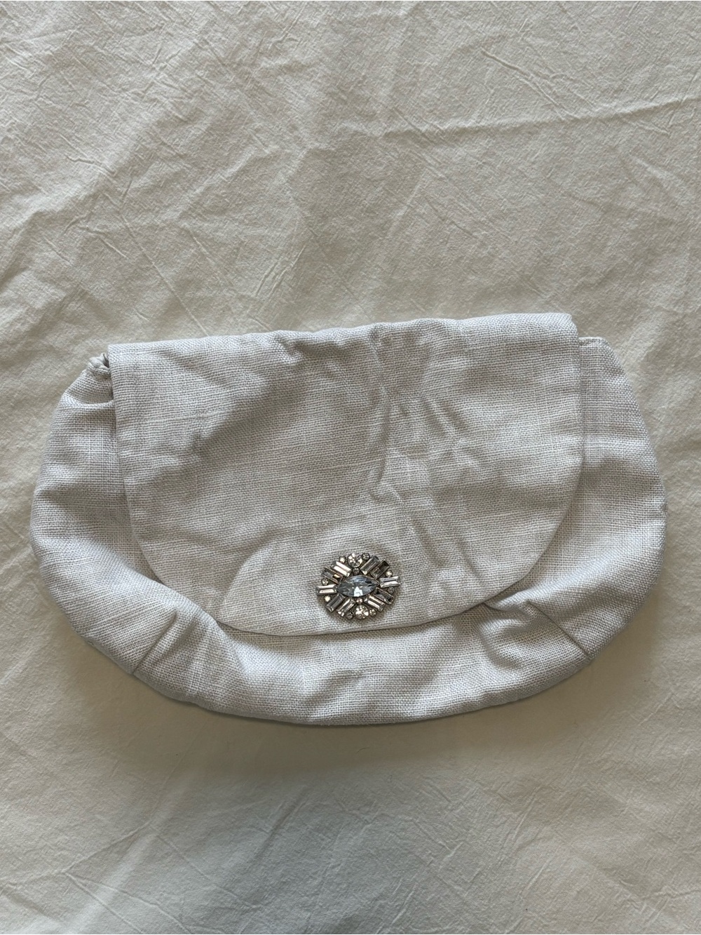 Elegant Ivory Linen Clutch with Decorative Gem Accent